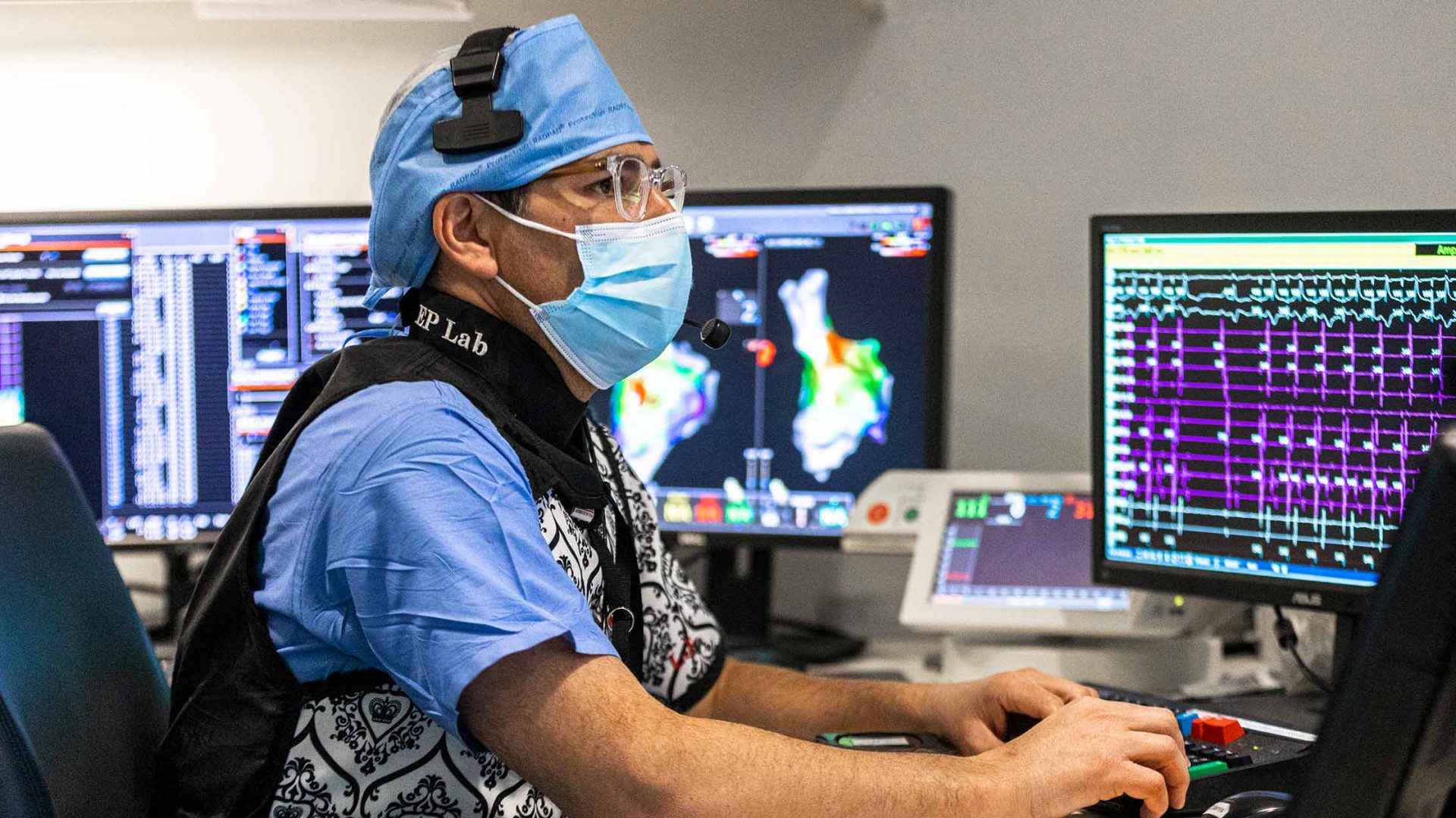 Dr. Lior Jankelson Sitting at Computer in Cardiac Electrophysiology Lab