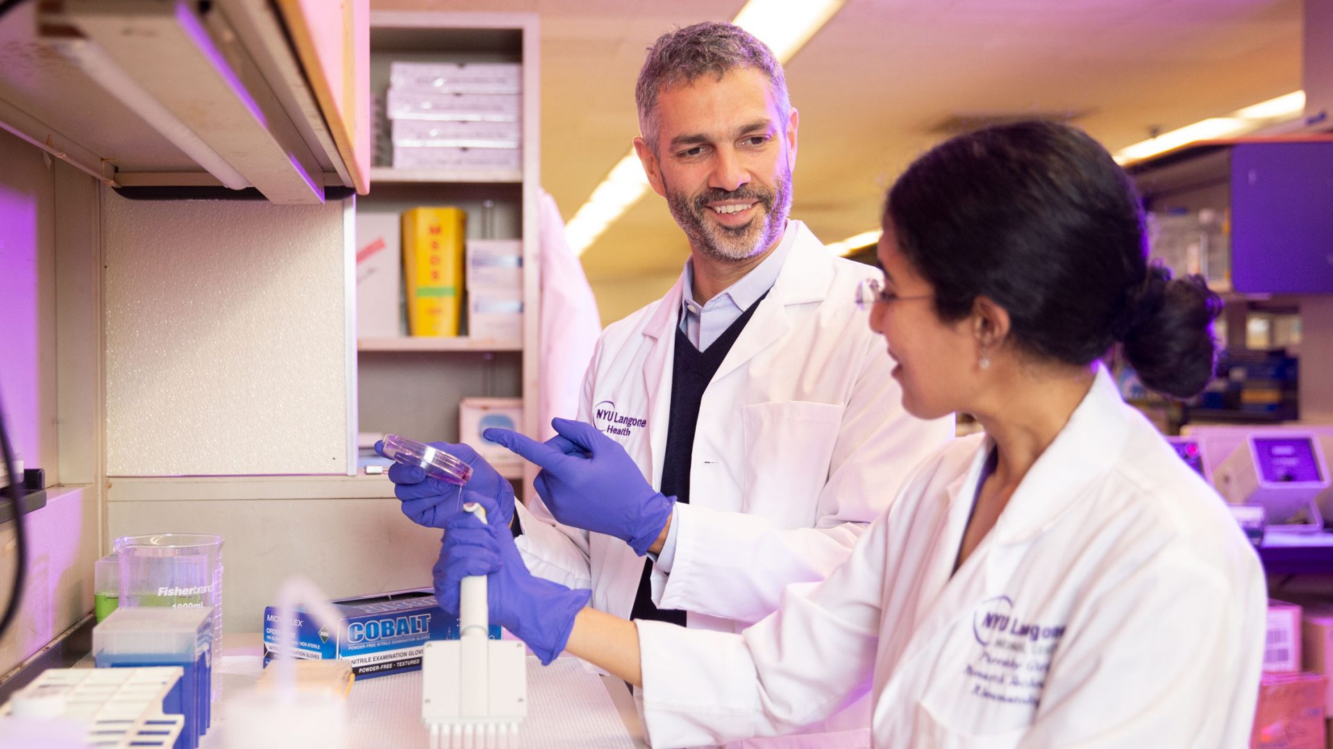 Dr. Jose U Scher and Colleague Working Together in Lab